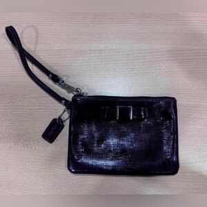Coach Elegant Purple Wristlet with Bow Accent